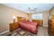 Bedroom with double bed, ceiling fan, and wood furniture at 3018 59Th S St # 209, Gulfport, FL 33707