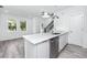 Modern kitchen with white cabinets, stainless steel appliances, and an island at 3402 E 28 Ave # 1, Tampa, FL 33605