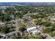 An aerial shot displays the building nestled amongst lush greenery in a suburban setting at 3402 E 28Th Ave # 1, Tampa, FL 33605