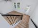 View from the top of the stairs looking into a room featuring hardwood floors at 3402 E 28Th Ave # 1, Tampa, FL 33605
