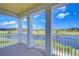 Private balcony overlooking a tranquil lake and lush landscape at 3731 Tea Leaf Aly, Land O Lakes, FL 34638