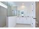 Elegant bathroom with double vanity, large shower, and modern fixtures at 3731 Tea Leaf Aly, Land O Lakes, FL 34638