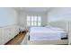 Main bedroom with king-size bed, dresser, and window with shutters at 3731 Tea Leaf Aly, Land O Lakes, FL 34638