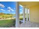 Covered patio with a view of the lake and lush landscaping at 3731 Tea Leaf Aly, Land O Lakes, FL 34638