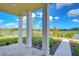 Charming covered patio with a view of the lake and landscaping at 3731 Tea Leaf Aly, Land O Lakes, FL 34638