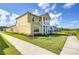 Side view of two-story house with landscaping and sidewalk at 3731 Tea Leaf Aly, Land O Lakes, FL 34638