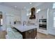 Spacious kitchen with a center island, stainless steel appliances, and white cabinets at 3731 Tea Leaf Aly, Land O Lakes, FL 34638