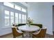 Bright kitchen nook features a round table and comfortable seating near a window at 3731 Tea Leaf Aly, Land O Lakes, FL 34638