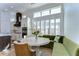 Charming kitchen nook with a round table and built-in banquette seating at 3731 Tea Leaf Aly, Land O Lakes, FL 34638