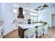 Bright kitchen features white cabinets, a large island, and high ceilings at 3731 Tea Leaf Aly, Land O Lakes, FL 34638