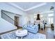 Open concept living area and kitchen with a staircase and light blue sofa at 3731 Tea Leaf Aly, Land O Lakes, FL 34638