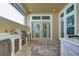 Stainless steel appliances and stone countertops in outdoor kitchen at 3731 Tea Leaf Aly, Land O Lakes, FL 34638
