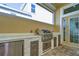 Luxury outdoor kitchen with stainless steel appliances at 3731 Tea Leaf Aly, Land O Lakes, FL 34638