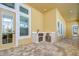 Covered patio with built-in outdoor kitchen and access to interior at 3731 Tea Leaf Aly, Land O Lakes, FL 34638