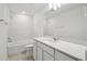 Bathroom with white cabinetry, white counters, tile floor, and subway tile shower at 4187 Feldspar Ln, Spring Hill, FL 34609