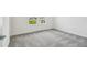 Bedroom featuring plush carpeting and a window overlooking the yard at 4187 Feldspar Ln, Spring Hill, FL 34609
