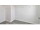 Spacious walk-in closet with wire shelving and neutral carpeting at 4187 Feldspar Ln, Spring Hill, FL 34609