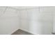 Walk-in closet with metal shelving and plush gray carpeting at 4187 Feldspar Ln, Spring Hill, FL 34609