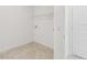 Laundry room with tile floors and overhead wire shelving for storage at 4187 Feldspar Ln, Spring Hill, FL 34609