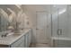 Modern bathroom featuring double vanity and glass shower at 4199 Feldspar Ln, Spring Hill, FL 34609