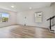 Bright and airy living room with laminate wood flooring at 4248 Goldfoil Rd, Spring Hill, FL 34609