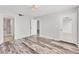 Primary bedroom with hardwood floors and en-suite bathroom at 4530 Pinebrook Cir # 208, Bradenton, FL 34209