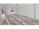 Spacious living room featuring hardwood floors and an open floor plan at 4530 Pinebrook Cir # 208, Bradenton, FL 34209