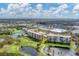 Community aerial view showcasing a golf course and ponds at 4530 Pinebrook Cir # 208, Bradenton, FL 34209