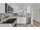 Modern kitchen with white cabinets and stainless steel appliances at 4530 Pinebrook Cir # 208, Bradenton, FL 34209