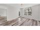 Spacious bedroom with hardwood floors and private balcony access at 4530 Pinebrook Cir # 208, Bradenton, FL 34209