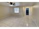 Bright living room with tile flooring and a ceiling fan at 5301 82Nd N Ave, Pinellas Park, FL 33781