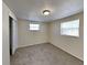 Well-lit bedroom featuring neutral walls and carpet at 5301 82Nd N Ave, Pinellas Park, FL 33781
