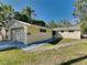 House exterior featuring a single-story home with a two-car garage and well-maintained lawn at 5301 82Nd N Ave, Pinellas Park, FL 33781