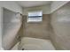 Bathroom with new bathtub and updated tile surround at 5301 82Nd N Ave, Pinellas Park, FL 33781