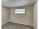 Simple bedroom with neutral walls and carpet at 5301 82Nd N Ave, Pinellas Park, FL 33781