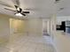 Open concept living area with tile floors and views into the kitchen at 5301 82Nd N Ave, Pinellas Park, FL 33781