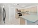 Bright kitchen with light wood cabinets and an island at 5344 Lowell Ave, Spring Hill, FL 34609