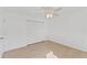 Spacious bedroom featuring wood-look floors and a ceiling fan at 5344 Lowell Ave, Spring Hill, FL 34609