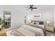 Bedroom with light walls, hardwood floors, and a view of backyard at 5344 Lowell Ave, Spring Hill, FL 34609