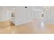 Open living room with hardwood floors and access to kitchen at 5344 Lowell Ave, Spring Hill, FL 34609