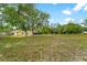 Large backyard with mature trees and a shed at 5344 Lowell Ave, Spring Hill, FL 34609