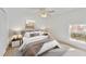 Bedroom with light walls, hardwood floors, and a view of backyard at 5344 Lowell Ave, Spring Hill, FL 34609