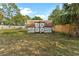 Metal storage shed in the backyard provides extra storage space at 5344 Lowell Ave, Spring Hill, FL 34609