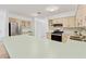 Modern kitchen with stainless steel appliances and a large island at 5344 Lowell Ave, Spring Hill, FL 34609