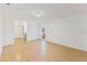 Large main bedroom with light laminate floors and access to en-suite bathroom at 5344 Lowell Ave, Spring Hill, FL 34609