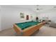 Game room with a pool table and sitting area at 5344 Lowell Ave, Spring Hill, FL 34609