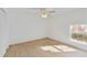Bright bedroom with ceiling fan, window, and laminate wood floors at 5344 Lowell Ave, Spring Hill, FL 34609