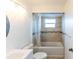 Updated bathroom featuring a tub shower, new tile, and vanity at 5344 Lowell Ave, Spring Hill, FL 34609