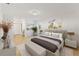 Spacious main bedroom with neutral decor and en-suite bathroom access at 5344 Lowell Ave, Spring Hill, FL 34609