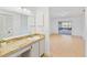 Bathroom with a vanity, mirror, and access to backyard at 5344 Lowell Ave, Spring Hill, FL 34609